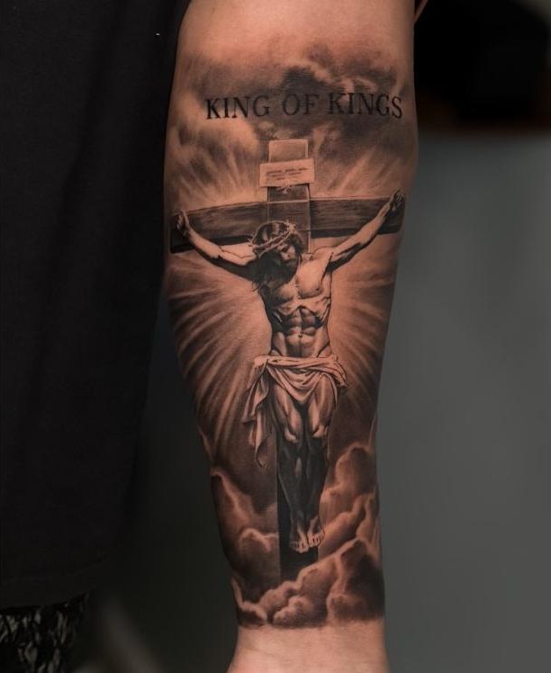 Crucifix with King of Kings lettering, forearm